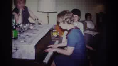 Rockaway Beach New York USA (1967): Woman Playing Piano For Guests At Family