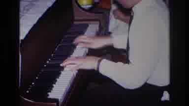 Rockaway Beach New York USA (1967): Boy Playing Piano