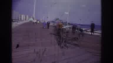 Rockaway Beach New York USA (1967): Person Walks Along Waterfront Smoking A