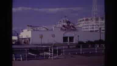 Rockaway Beach New York USA (1967): People Walking Past Near Empty Amusement Park
