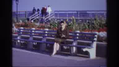 Rockaway Beach New York USA (1967): Camera Panning Out On Woman Sat In A Bench