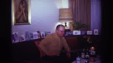 Rockaway Beach New York USA (1967): Man With Brown Top Sitting At A Table Full Of