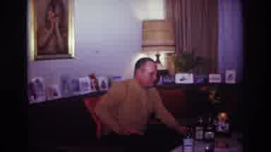 Rockaway Beach New York USA (1967): Wife Serving Drinks To Her Husband Who Is