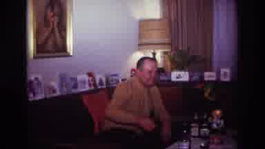 Rockaway Beach New York USA (1967): Man Sitting On The Couch Next To A Lamp