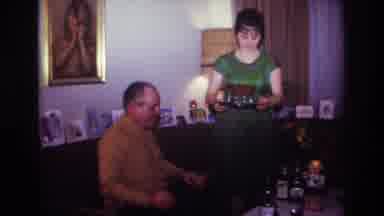 Rockaway Beach New York USA (1967): A Woman Serving Martinis To Her Guest At Her