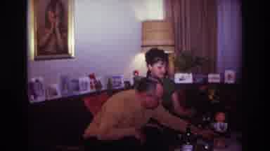 Rockaway Beach New York USA (1967): Man And Woman Tinker With Table Decoration