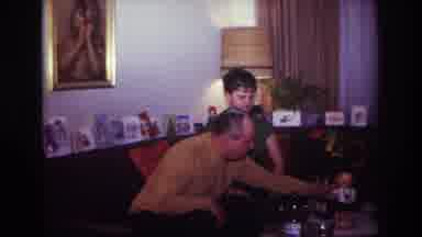 Rockaway Beach New York USA (1967): Family In A House Playing With A Toy