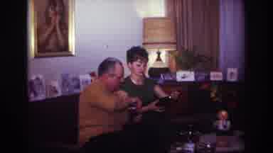 Rockaway Beach New York USA (1967): A Couple Sitting In The Living Room Opening