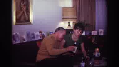 Rockaway Beach New York USA (1967): Husband And Wife Pouring Drinks In Their