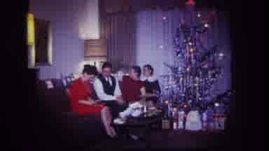Rockaway Beach New York USA (1967): Four People Sitting On The Couch At Christmas