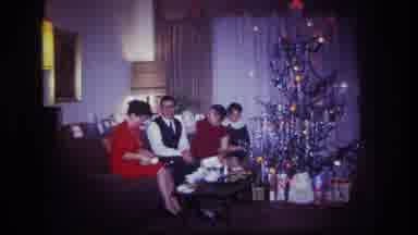Rockaway Beach New York USA (1967): A Family Of 4 Exchanging Gifts On Christmas