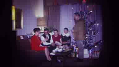 Rockaway Beach New York USA (1967): Woman In Red Dress Opening Up Christmas Gift