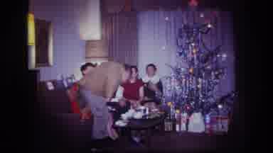 Rockaway Beach New York USA (1967): People Sitting In A Couch Near A Christmas