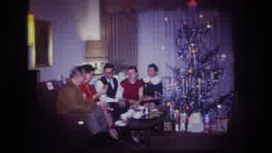 Rockaway Beach New York USA (1967): Family Sitting On Sofa And Laughing Next To