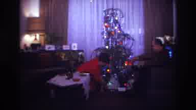 Rockaway Beach New York USA (1967): A Couple Sits Beside A Christmas Tree, With