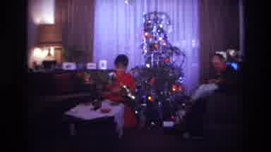 Rockaway Beach New York USA (1967): A Man And Woman In Front Of A Christmas Tree
