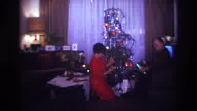 Rockaway Beach New York USA (1967): A Man And Woman Opening Presents In Front Of A