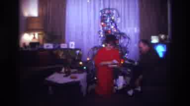 Rockaway Beach New York USA (1967): 1960s Christmas Gift Opening In Front Of Tree