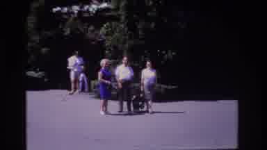 Ocean City New Jersey USA (1968): Family Leaving House While Others Walk A Dog