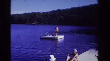 Ocean City New Jersey USA (1968): Two People On Pier In Middle Of Lake One Lying