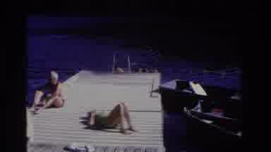 Ocean City New Jersey USA (1968): Two Boys Swimming To A Dock While A Man And