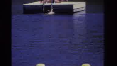 Ocean City New Jersey USA (1968): A Young Boy Swimming To A Diving Raft Where