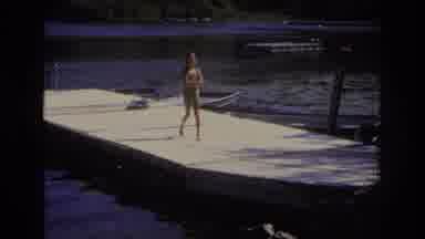 Ocean City New Jersey USA (1968): Small Girl In Swimwear, Walking On A Deck On A