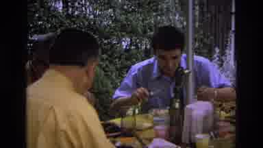 Ocean City New Jersey USA (1968): Family Gathered Around A Table Eating A Meal