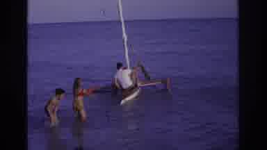 Ocean City New Jersey USA (1968): Man Climbing Onto Rocking Sailboat While