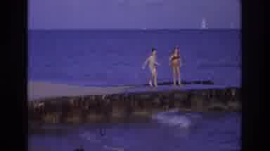 Ocean City New Jersey USA (1968): A Boy And Girl Are Running On The Beach Then