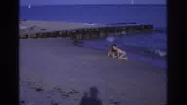 Ocean City New Jersey USA (1968): Boy And Girl Play And Splash Water On The Beach