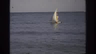 Ocean City New Jersey USA (1968): A Person Rides On A Small Sailboat Bobbing In
