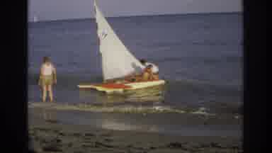 Ocean City New Jersey USA (1968): Men Attempt To Pull Sailboat Out Of Water Onto
