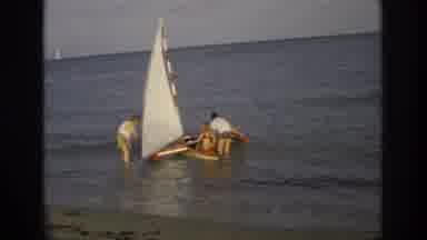 Ocean City New Jersey USA (1968): Group Helping To Get Mini Sailboat Out To Sea