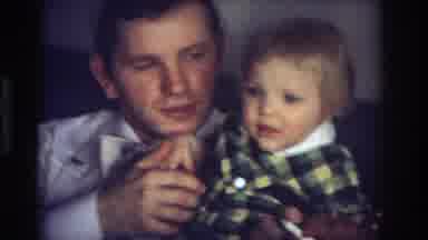 Ocean City New Jersey USA (1968): A Man Wearing A Bowtie Holds A Toddler While A
