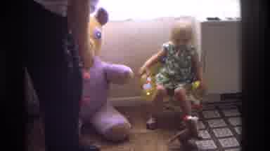 Ocean City New Jersey USA (1968): Child Playing With Her Favorite Toy While Father