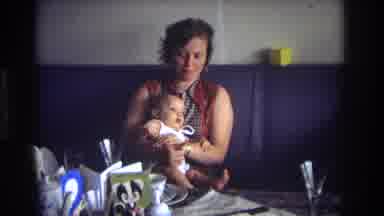 Ocean City New Jersey USA (1968): Mother Holding Baby In Dining Room And Grandpa