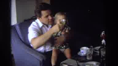 Ocean City New Jersey USA (1968): Man In Chair Offering Beverage To Child Then