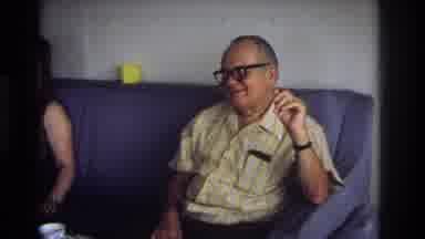 Ocean City New Jersey USA (1968): Two People Sitting On A Blue Couch Holding A