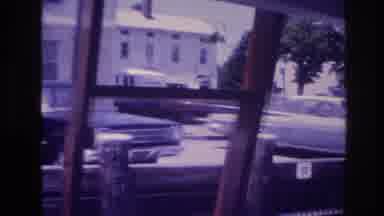 Ocean City New Jersey USA (1968): Man Arranging Equipment Near Road And Parking