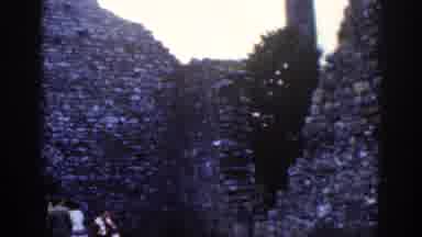 Dublin Ireland (1961): Group Of Tourists Exploring Ancient Ruins On A Cool