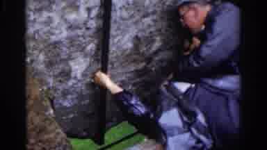 Dublin Ireland (1961): A Man Kisses A The Blarney Stone In Ireland, Helped Up By