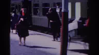 Dublin Ireland (1961): Lady Looking Back At Crowd Gathered A Train Prepared To Set