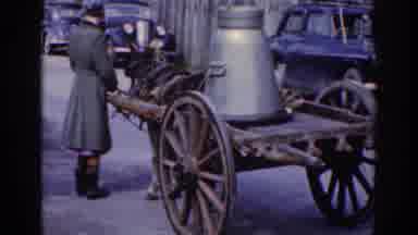 Dublin Ireland (1961): Woman Standing Next To Wooden Cart Being Pulled By A Donkey