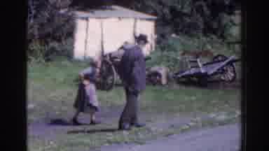 Dublin Ireland (1961): People Standing By A Roadside In A Small Village Watching