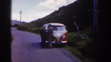 Ireland (1961): Two Men Standing In Front Of A Volkswagen Bus Across From What
