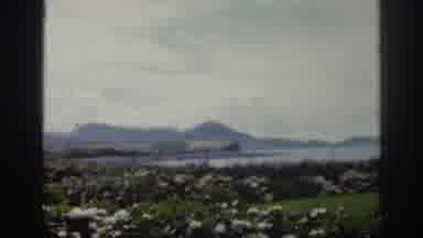 Ireland-1961: 1960s Summer Panoramic View of Coastal Town and Mountains