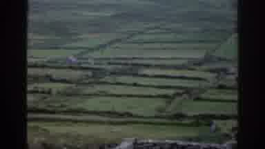 Ireland (1961): The Camera Is Showing A Old Grassy Field With Very Old Stone Walls