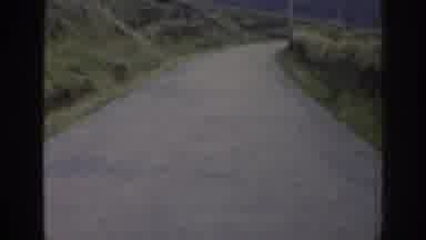 Ireland (1961): Car Driving Along A Narrow Road