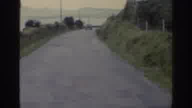 Ireland (1961): Group Of Sheep Encounter Random Car